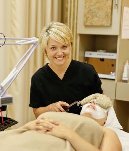 Esthetician student with client