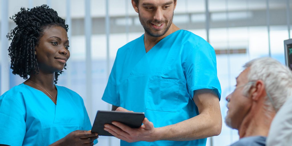 Patient Care Technicians speaking with patient