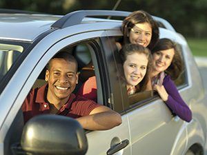 students in car