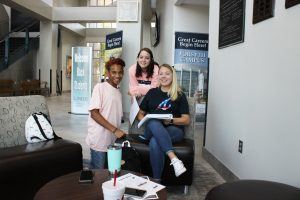 three students in lobby of Forsyth campus