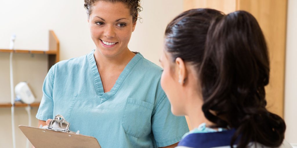 Certified Clinical Medical Assistant speaking with patient